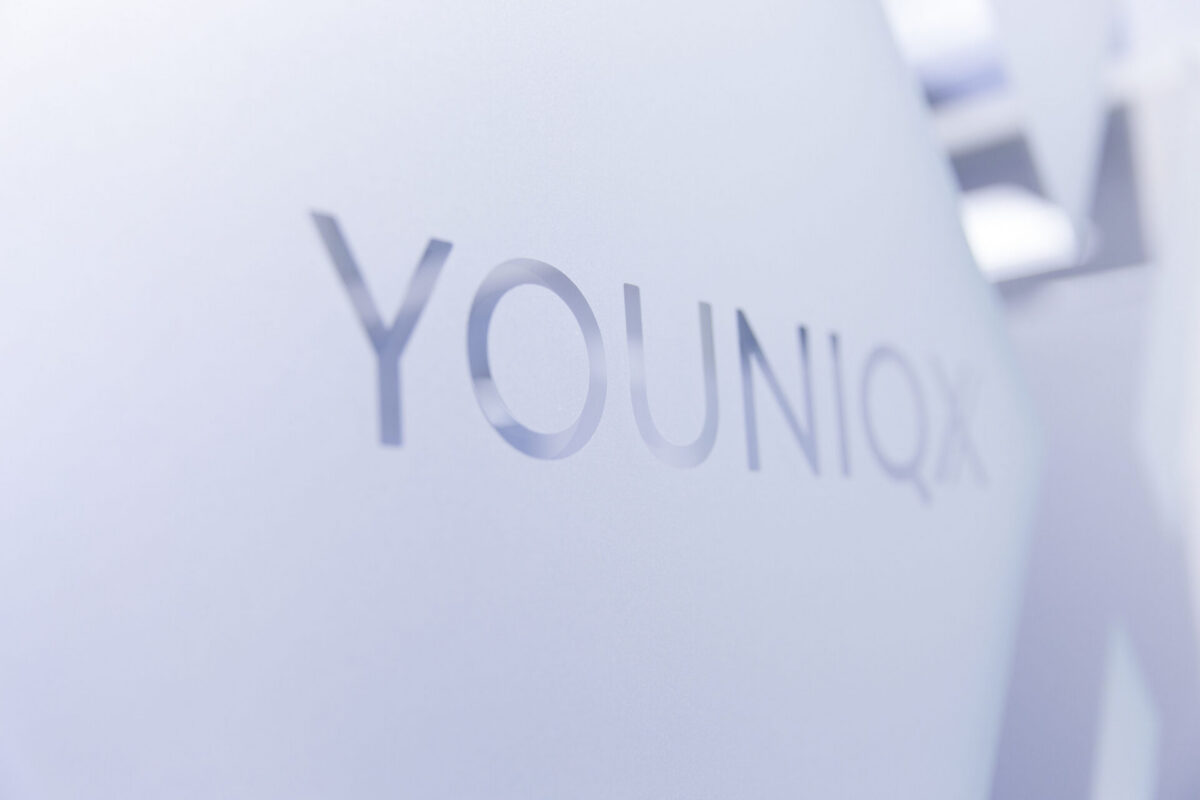 youniqx logo on a glass surface