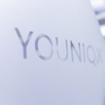 youniqx logo on a glass surface